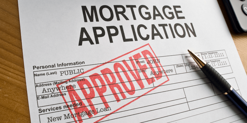 A printed Mortgage Application with a red APPROVED stamp.